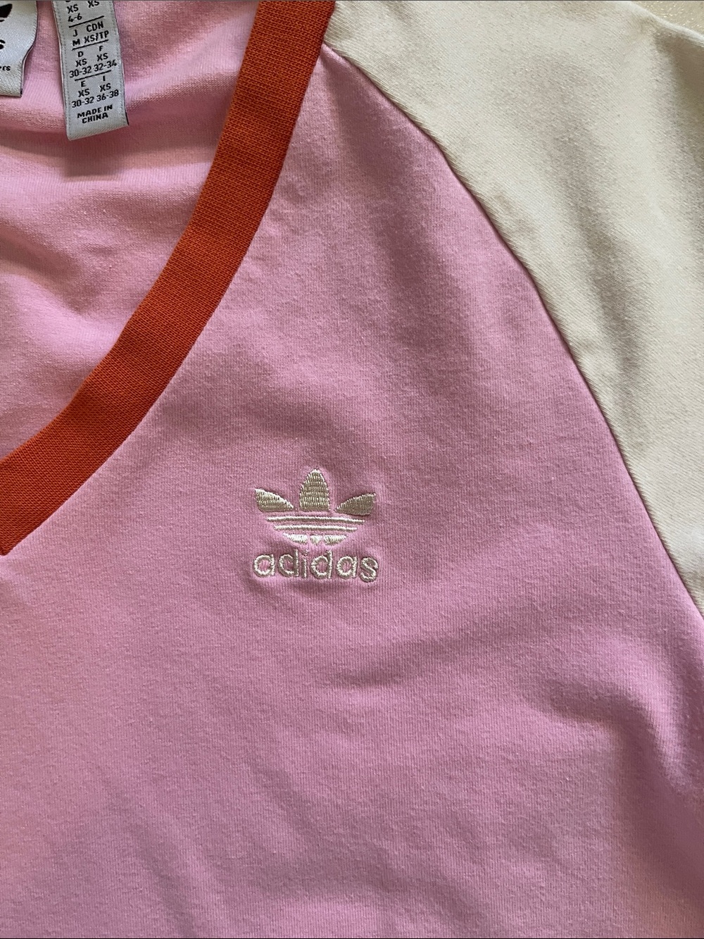 adidas Pink V-Neck Tee with Orange Trim and cream Sleeves